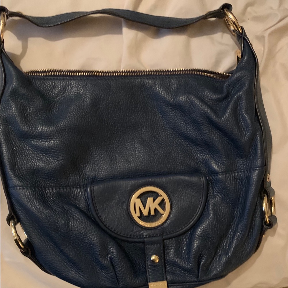 Michael Kors handbag with cleaner